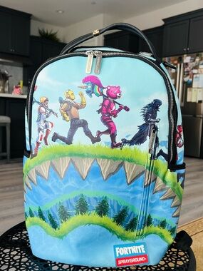 Sprayground Fortnite Kids Light Blue Character Backpack with Pink Accents